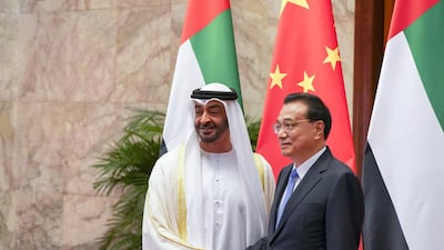 Sheikh Mohamed bin Zayed stands for a photograph with Chinese Premier Li Keqiang at the Great Hall of the People in Beijing. Ministry of Presidential Affairs