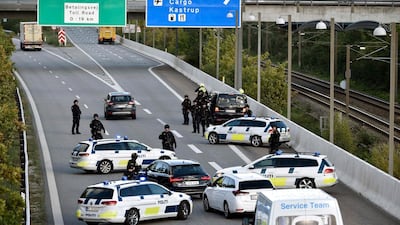 Police vehicles block the street leading to the Oeresund Bridge near Copenhagen, Denmark, 28 September 2018. EPA