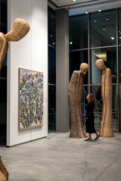 Carved wooden sculptures titled The Guardians, by Chaouki Choukini. Photo: Dubai Culture