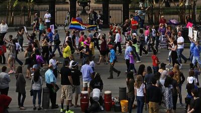 Part of a group of several thousand people make their way past Jackson Square and St Louis Cathedral on Decatur Street while taking part in a Women’s March in New Orleans. Max Becherer / AP Photo