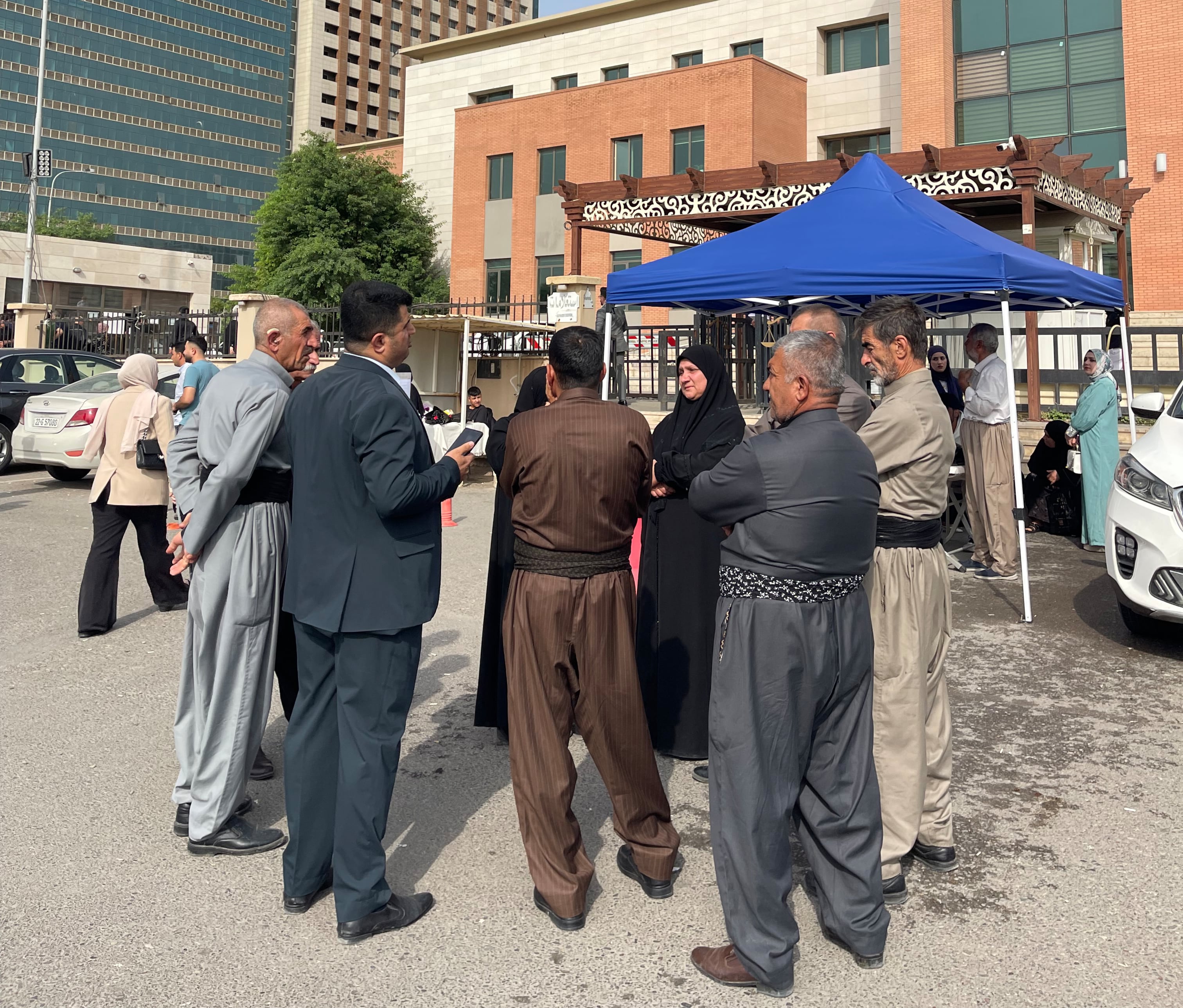 Families of victims before the court hearing in Erbil. Aveen Karim/The National