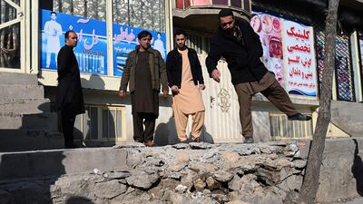 Residents gather at a site after several rockets land at Khair Khana, north west of Kabul. A series of loud explosions shook central Kabul on November 21, including several rockets that landed near the heavily fortified Green Zone where many embassies and international firms are based, officials said. AFP