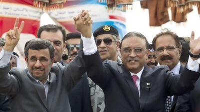 Iranian president Mahmoud Ahmadinejad, left, celebrates the inauguration of the Pakistan-Iran gas pipeline project with his Pakistani counterpart Asif Ali Zardari in Chahbahar near the Pakistani border in Iran.