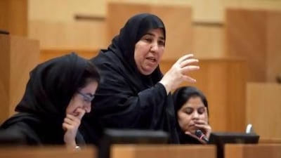 Fujairah FNC member Aisha Al Yammahi, also a school principal, makes her point on the need for teachers to be properly evaluated to the Minister for Education in yesterday’s council session. Silvia Razgova / The National