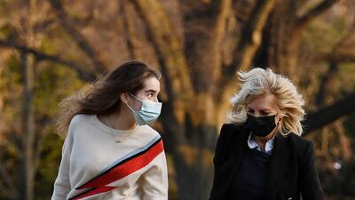 Jill Biden is dressed down in jeans and a jumper as she walks with her granddaughter Natalie Biden, across the White House South Lawn on March 14, 2021. AFP