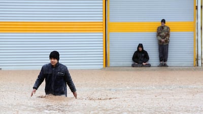 An Iranian man crosses a flooded street in the city of Khorramabad, Lorestan Province, western Iran. EPA