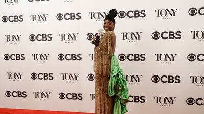 US actress Joaquina Kalukango in a golden outfit with a green train. EPA
