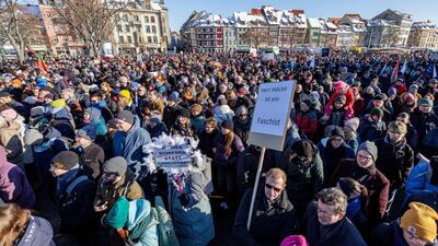 People take part in a demonstration against racism and far right politics, in Erfurt, eastern Germany on January 20, 2024. Revelations that members of Germany's far-right AfD discussed mass deportation plans have pushed tens of thousands of people to protest and sparked a debate on whether the anti-immigrant party should be banned. From Cologne to Leipzig to Nuremberg, Germans across the country have poured into the streets over the last week, with another 100 demonstrations expected through the weekend. (Photo by JENS SCHLUETER / AFP)