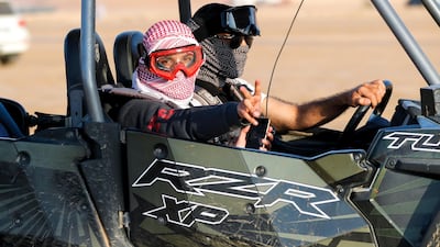 A participant waves from his off-roader. Victor Besa / The National