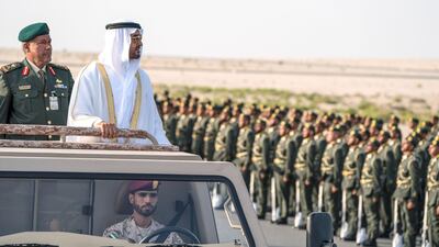 Sheikh Mohammed toured the lines of soldiers in an open top armoured vehicle manufactured by the Emirati company Nimr. Seen with Brigadier Faisal Mohamed Al Shehhi (L). Hamad Al Kaabi / Crown Prince Court - Abu Dhabi