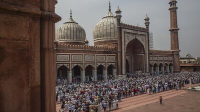 Indian Muslims offer congregational Friday prayers at the Jama Masjid (Grand Mosque) amid the government imposing restriction on assembly of more than 20 people over the coranavirus threat in Delhi. Getty Images