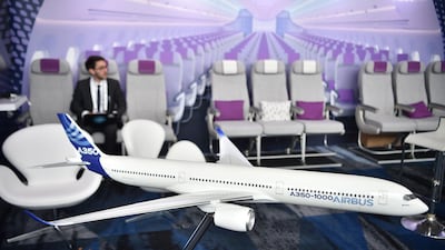 A scale model of an Airbus A350-1000 passenger aircraft is seen at the International Air Transport Association (IATA) annual meeting in Sydney last year. The trade body is expected to revise its revenue forecast for the industry downwards at this year's meeting. AFP