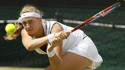 Petra Kvitova returns a shot against Maria Sharapova during the final of Wimbledon on Centre Court on Saturday.