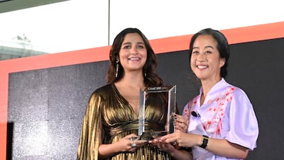 SINGAPORE, SINGAPORE - OCTOBER 02: Alia Bhatt, Actor and Producer receives her award the TIME100 Impact Awards on October 02, 2022 in Singapore. (Photo by Edwin Koo / Getty Images for TIME)