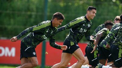 Manchester United's Raphael Varane and Cristiano Ronaldo train. PA