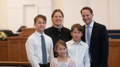 Roland Baeck with his family at the church. The Utah-based faith plans to build a temple near Expo City Dubai. Ruel Pableo for The National