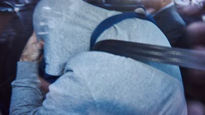 epa06127725 A man in a police vehicle is moved by Australian Federal Police from Sydney's Police headquarters in Surry Hills, Sydney, Australia, 06 August 2017. A Sydney man arrested over a plot to bomb a plane bound for the Middle East has been charged with a non-terror related offence. EPA/AARON BUNCH AUSTRALIA AND NEW ZEALAND OUT