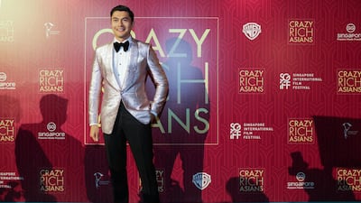 Actor Henry Golding poses as he arrives for the red carpet screening of the movie 'Crazy Rich Asians'. Don Wong / AP photo