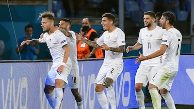 Ciro Immobile (L) of Italy celebrates with teammates after scoring the second. EPA