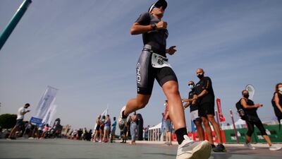 Julie Iemmolo of France in action during the Ironman 70.3 Dubai 2021 triathlon. Competitors ran a 21.1km course along the city's coastline. EPA