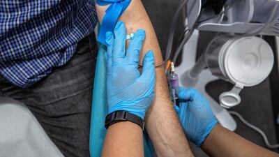 Andy Scott is fitted with the wearable diabetes monitoring device, one example of how technology is helping people to improve their health and live longer lives