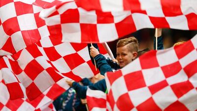 Stoke City supporters wave flags prior to the Premier League match against Chelsea on Saturday at the Britannia Stadium. Laurence Griffiths / Getty Images