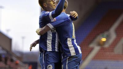 Centre midfield: Ben Watson, Wigan. The man whose goal won the FA Cup last year was on target again in the victory over Crystal Palace. Clint Hughes / AP