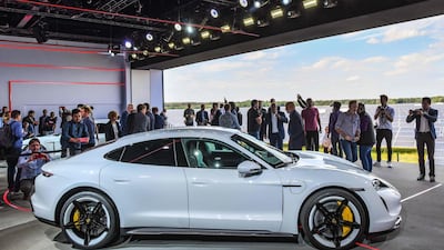 The Porsche Taycan electric car is presented to the public as a world premiere in a hall at the airfield of Neuhardenberg, eastern Germany. AFP