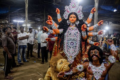 Artisans put finishing touches to statues of Hindu deities before they are sent out to customers for the Durga Puja festival. AFP