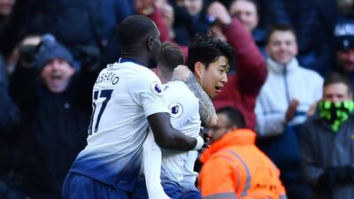 Son Heung-min, right, is mobbed by teammates after giving Tottenham the lead against Newcastle. Reuters