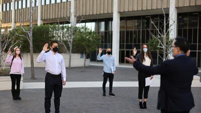 Immigrants participate in a socially-distanced outdoor naturalisation ceremony to become new US citizens, as the coronavirus outbreak continues, in Los Angeles, California. Reuters