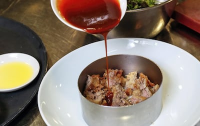 Drizzle half the duck salad sauce over the meat