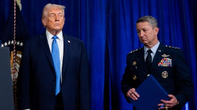 US President Donald Trump and John D Caine, chairman of the Joint Chiefs of Staff, during a news conference at Mar-a-Lago, Florida, US, on Saturday. Bloomberg