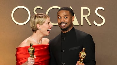 Jessie Buckley, Best Actress Oscar winner for Hamnet and Michael B Jordan, Best Actor Oscar winner for Sinners pose with their awards in the photo room at the 98th Academy Awards in Hollywood, Los Angeles, California, US. Reuters