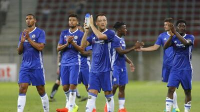 Chelsea captain John Terry leads the applause of the fans after the match. Heinz-Peter Bader / Reuters