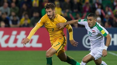 Australia's Mathew Leckie, left, vies for the ball with Iraq's Ali Abbas during a World Cup 2018 football qualifier match in Perth last week. Tony Ashby / AFP