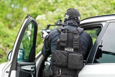 UK police officers demonstrate armed stop and arrest techniques on a driver during a demonstration organised by Devon And Cornwall Police to prepare for the forthcoming G7 summit. Getty