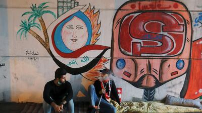 A demonstrator smokes a water pipe during an ongoing anti-government protests. Reuters