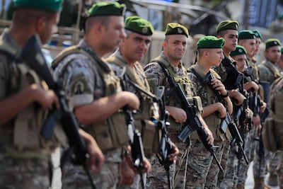 Lebanese army soldiers deploy to escort trucks carrying weapons handed over by Palestinian factions in south Lebanon. AP