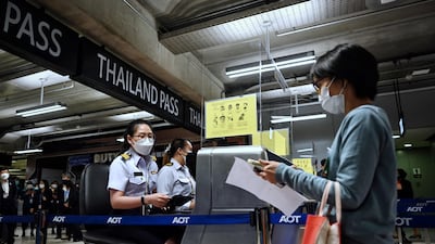 Airport staff practise entering Thailand at Suvarnabhumi International Airport, Bangkok, as they rehearse reopening procedures to welcome the first group of vaccinated tourists without quarantine. AFP