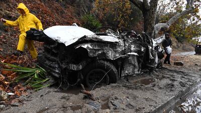 Mud fills a street after a rain-driven mudslide destroyed two cars and damaged property in a neighborhood under mandatory evacuation in Burbank, California. AFP PHOTO / Robyn Beck