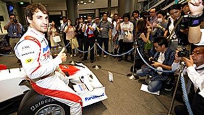 Toyota's Timo Glock, who came second in the Singapore Grand Prix, gives a thumbs up during a press conference for the upcoming Japanese Grand Prix at the company's Tokyo showroom.