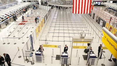 The area for TSA screening of travelers at JFK airport's Terminal 1 is relatively empty, Friday, March 13, 2020, in New York. AP Photo
