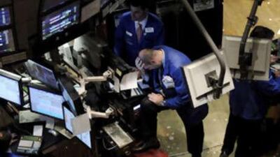 Traders work on the floor of the New York Stock Exchange at the end of the trading day in New York, New York, on Nov 6 2008.