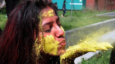 Indian students from Guru Nanak Dev University take part in Holi festival celebrations at the university campus in Amritsar, India. EPA