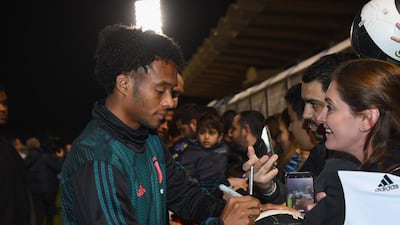 Juan Cuadrado signing autographs. Getty