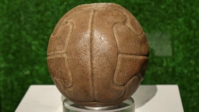 The official match ball from the first Fifa World Cup in Uruguay, 1930, on display during the 'World of Football' exhibition in Doha. AFP