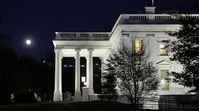 The moon rises over the White House in Washington on November 13, 2016. AFP