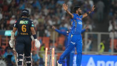 Mumbai Indians' Jasprit Bumrah celebrates the wicket of Wriddhiman Saha. AP