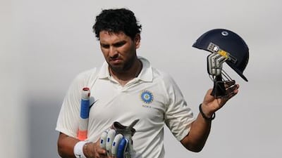 Indian cricketer Yuvraj Singh walks back to the pavilion during his appearance for the India A side against England